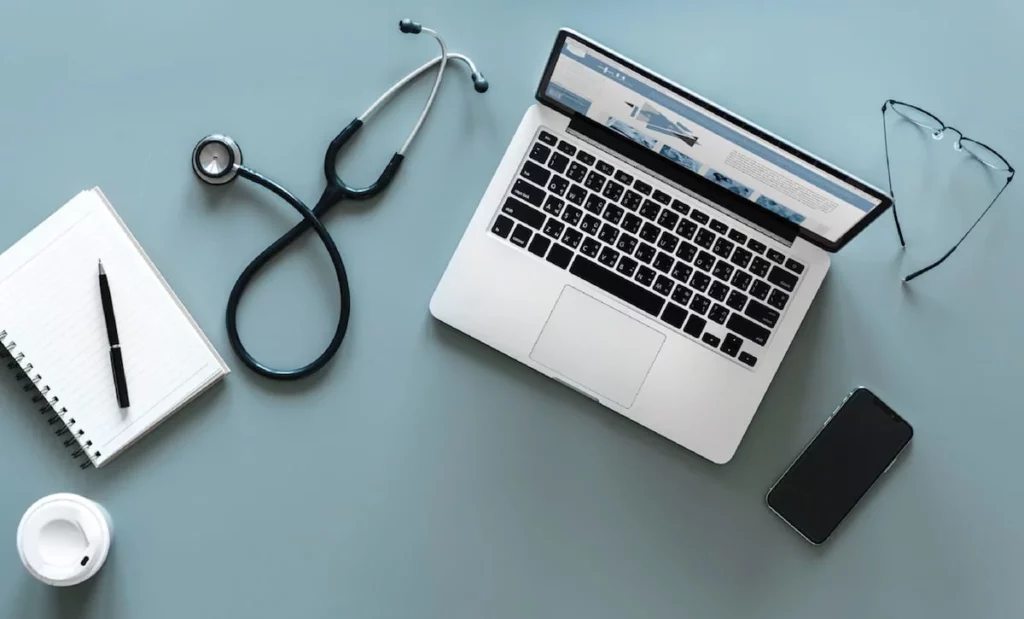 Laptop and medical equipment on a table