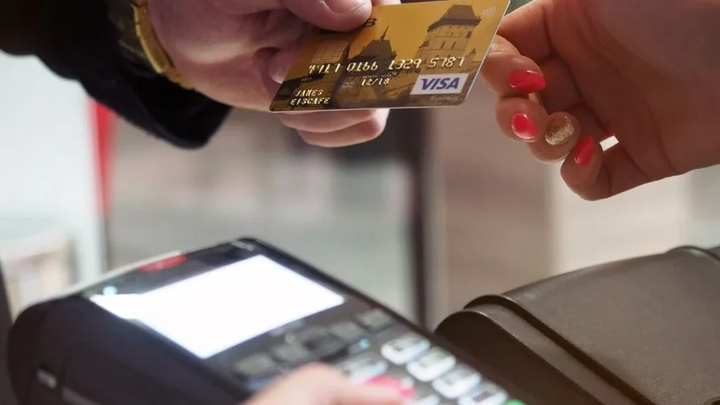 photo of person handing card