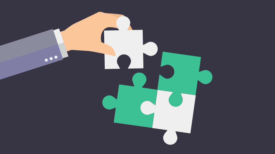 image of a hand putting a jigsaw piece in place