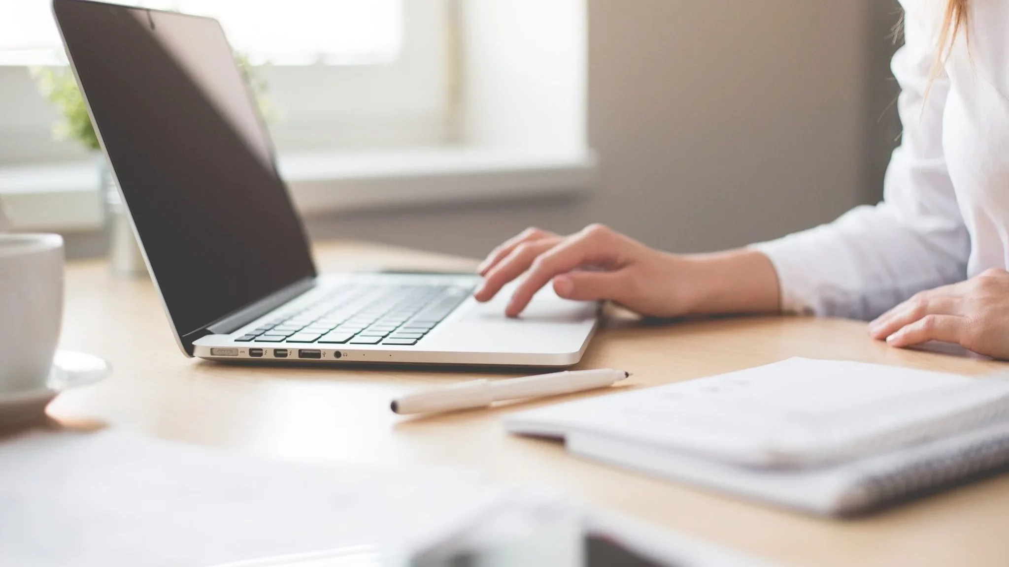 close up of woman working on laptop